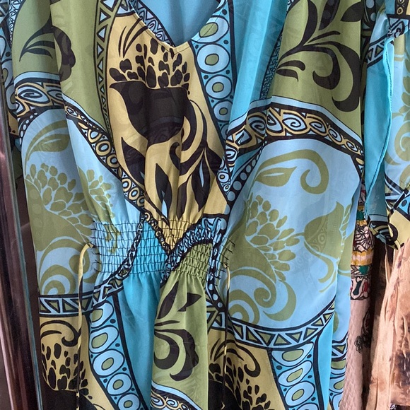 Shear colorful blouse with waist tie in front and back. - Picture 2 of 3